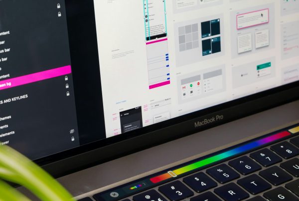 Computer monitor showing app designer improving UI design